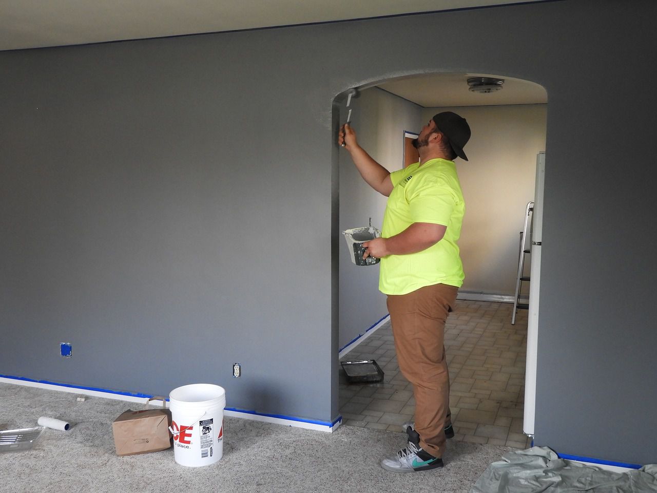 painter in a room with a modern electric fire